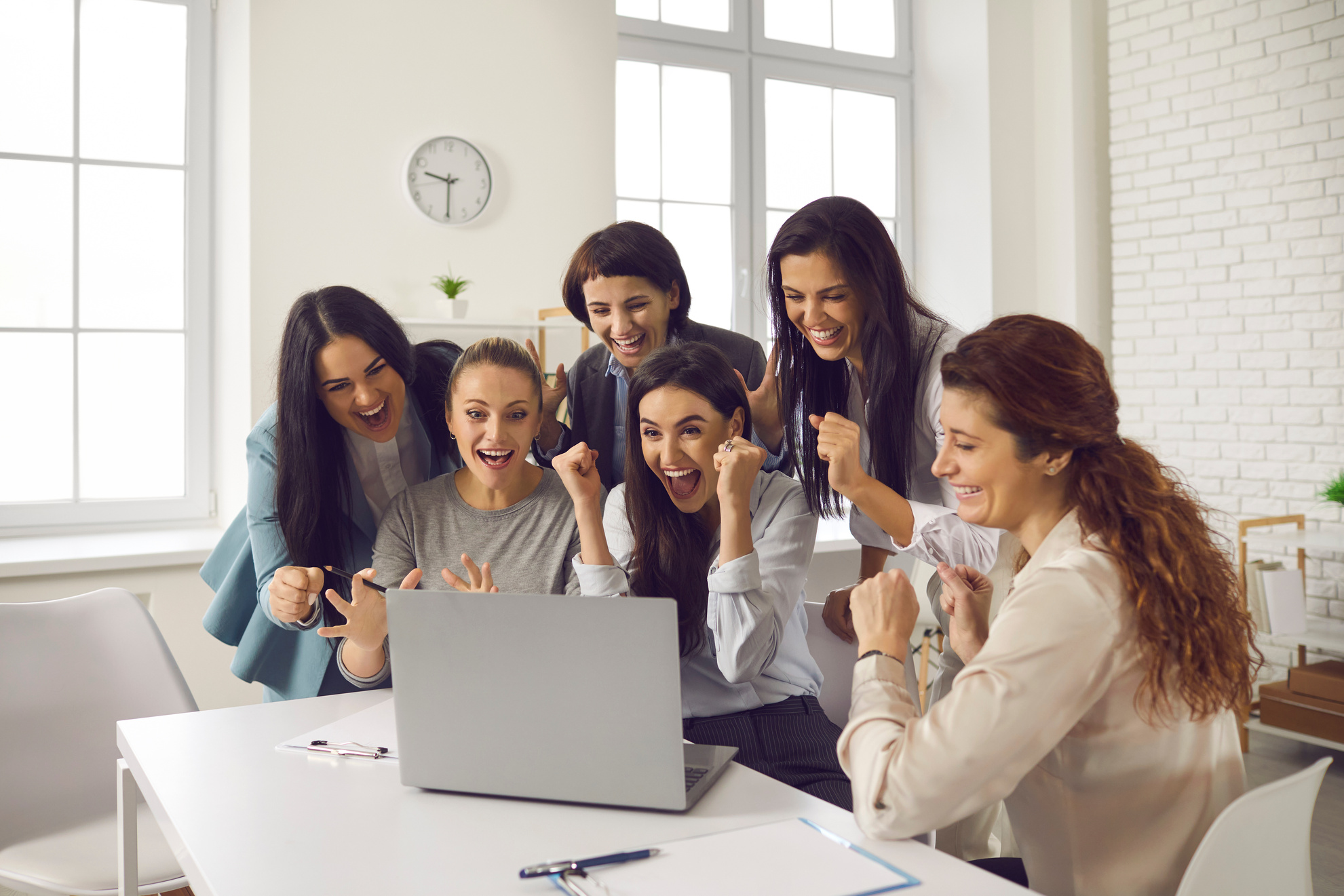 Jubilant Young Business Women Celebrating Successful Deal or Project Realization